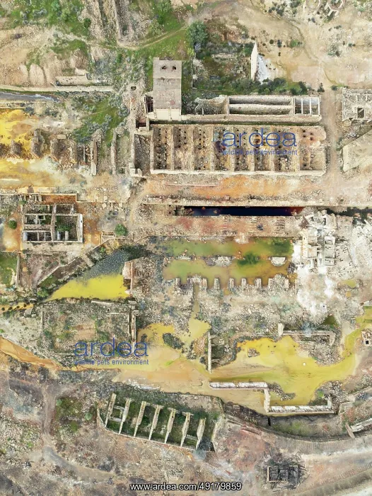 : Old mining site and deep orange-red hues in the water of a pool in the mineral-rich area of the Rio Tinto mines : Old mining site and deep orange-red hues in the water of a pool in the mineral-rich area of the Rio Tinto mines