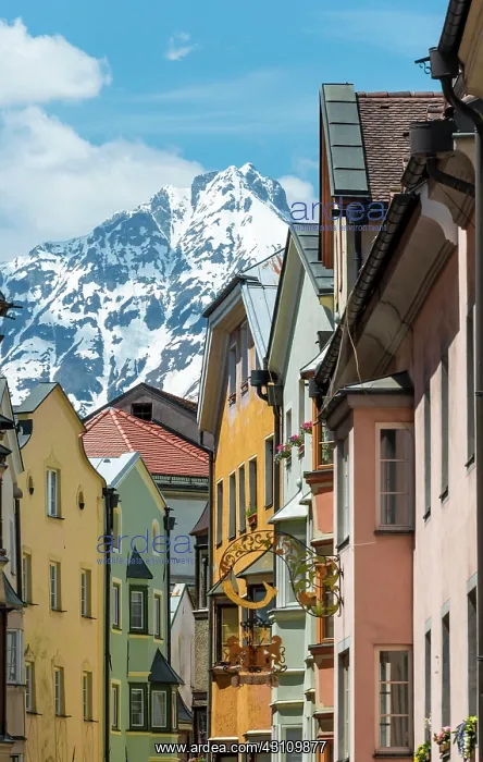 : Old town, colorful row of houses in front of mountains : Old town, colorful row of houses in front of mountains