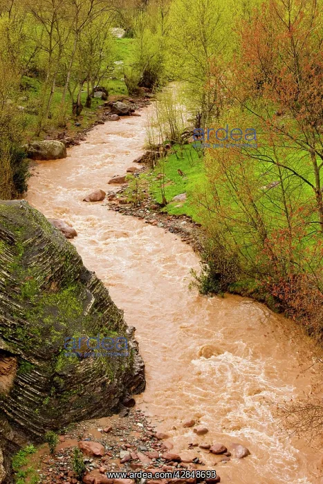 : The Ourika river in spate after heavy rain, showing : The Ourika river in spate after heavy rain, showing
