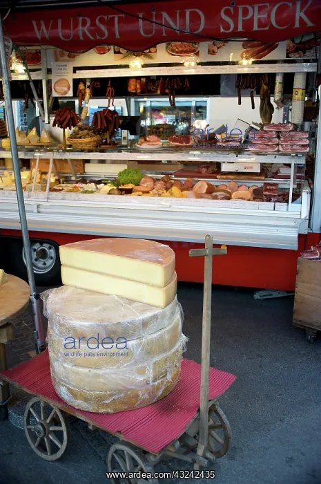 : Outdoor market selling meat and cheese : Outdoor market selling meat and cheese
