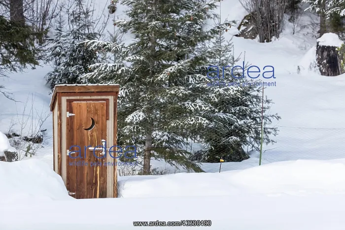: An outhouse in a wintry scene : An outhouse in a wintry scene