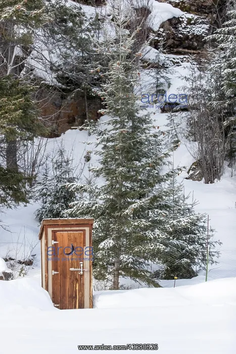 : An outhouse in a wintry scene : An outhouse in a wintry scene