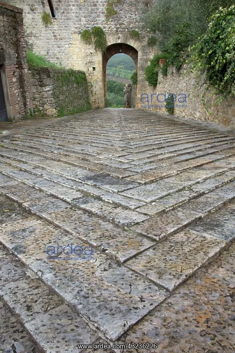 : Pattern in stones on street and arched walkway : Pattern in stones on street and arched walkway