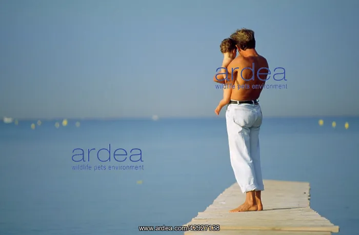 : People - man & baby on pier : People - man & baby on pier