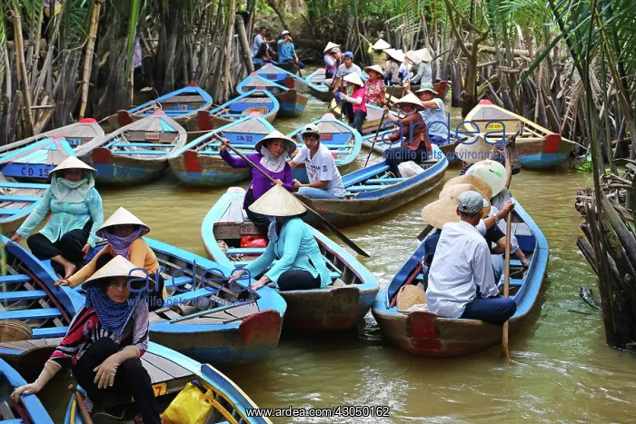  : People on Sampan boats on canals on Con Lan (Unicorn) Is