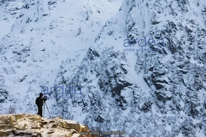 : Photographer on a hill in the snow, Norway : Photographer on a hill in the snow, Norway