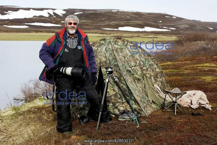 : Photographer - standing outside tent : Photographer - standing outside tent
