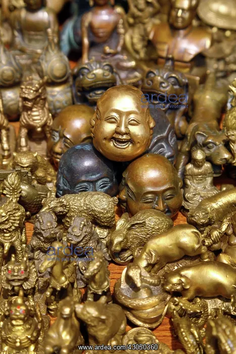 : Pile of brass figures including laughing Buddha head in : Pile of brass figures including laughing Buddha head in