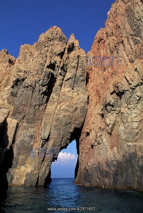 : Pink Granite rock formation and tunnel over the sea : Pink Granite rock formation and tunnel over the sea