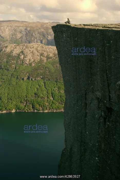 : Preikestolen - person meditating near the edge : Preikestolen - person meditating near the edge