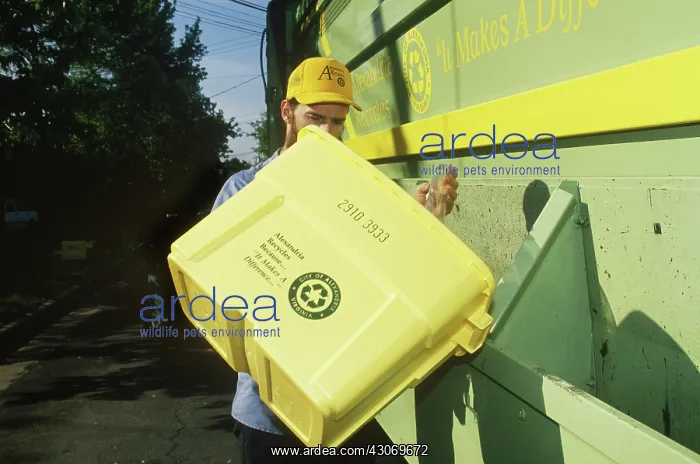 : Recycling. Emptying a bin at a recycling center. Virginia : Recycling. Emptying a bin at a recycling center. Virginia