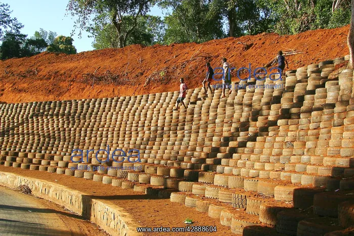 : Recycling - installing car tyres to stop erosion : Recycling - installing car tyres to stop erosion