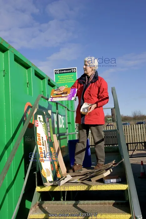: Recycling - Woman recycling cardboard : Recycling - Woman recycling cardboard