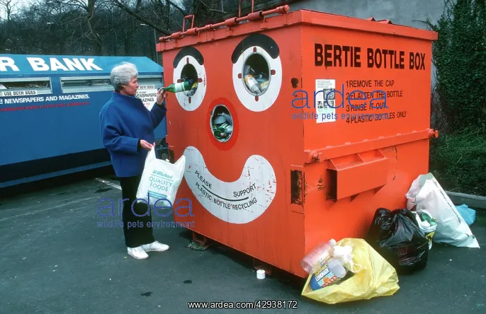 : Recycling - woman recycling plastic bottles in : Recycling - woman recycling plastic bottles in