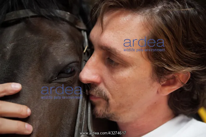  : Riding instructor cuddling a horse - Argentina
