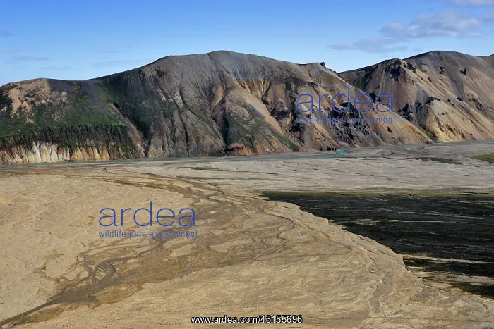 : River delta in front of mountains in vulcanic landscape : River delta in front of mountains in vulcanic landscape