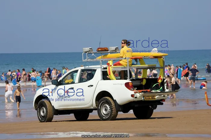 : RNLI Beach Lifeguards Rescue vehicle on crowded : RNLI Beach Lifeguards Rescue vehicle on crowded