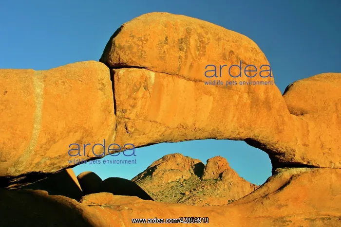 : Rock arch - ablaze in late evening light framing : Rock arch - ablaze in late evening light framing