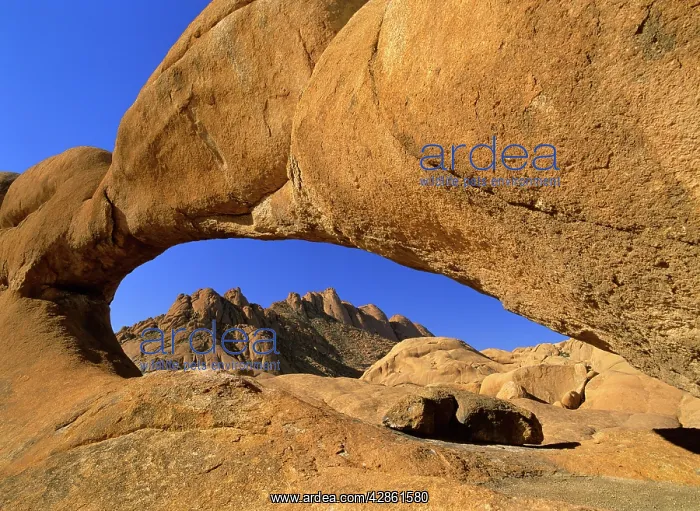 : Rock arch - Pandock mountains seen through a rock : Rock arch - Pandock mountains seen through a rock