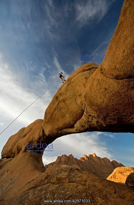 : Rock Climber - absailing a rock arch : Rock Climber - absailing a rock arch