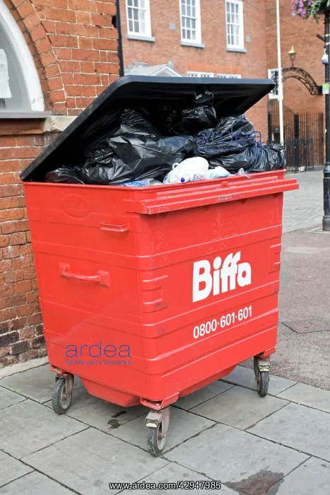: Rubbish Bin - Overflowing red Biffa waste bin on street : Rubbish Bin - Overflowing red Biffa waste bin on street