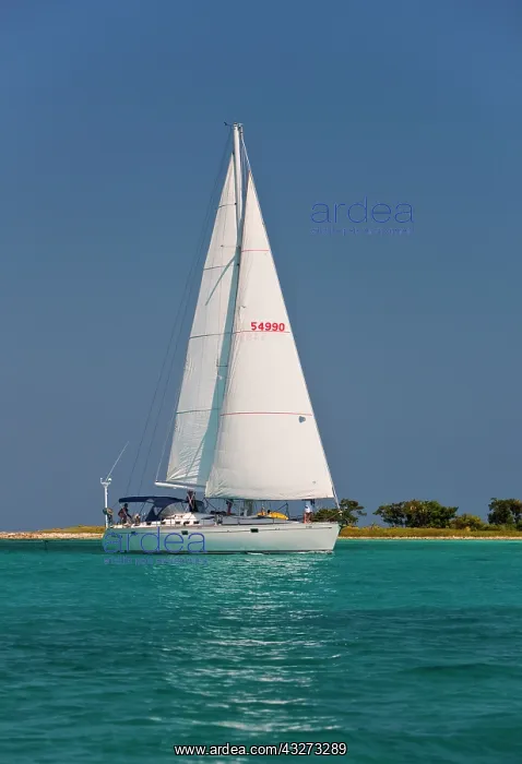: A sail boat sailing by Laughing Bird Cay : A sail boat sailing by Laughing Bird Cay