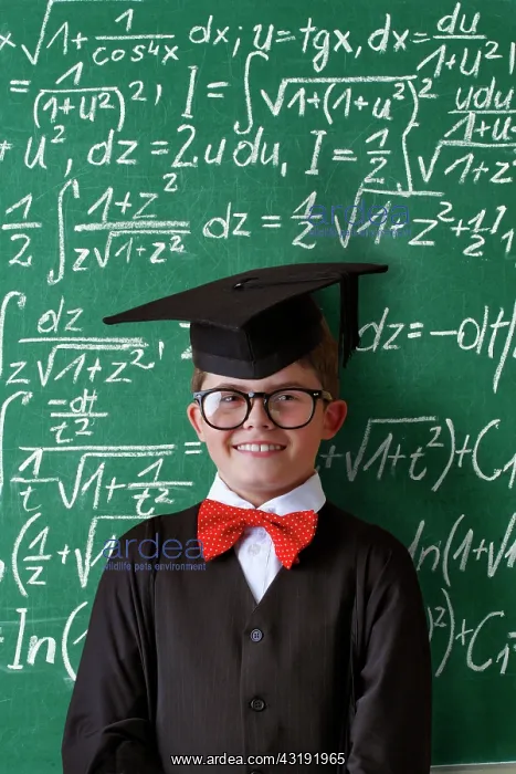 : Schoolboy wearing a graduation cap, glasses and : Schoolboy wearing a graduation cap, glasses and