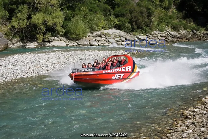 : Shotover jet boat skimming through Shotover canyon : Shotover jet boat skimming through Shotover canyon