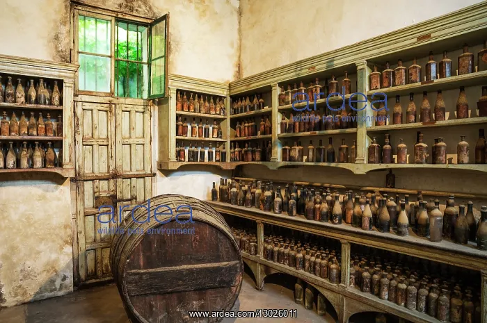 : Showroom with old dust covered sherry bottles at the B : Showroom with old dust covered sherry bottles at the B