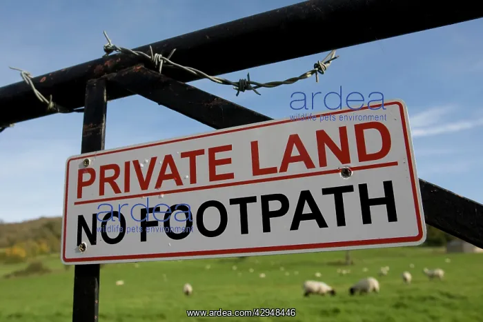 : Sign - Private land no footpath on barbed wired gate : Sign - Private land no footpath on barbed wired gate
