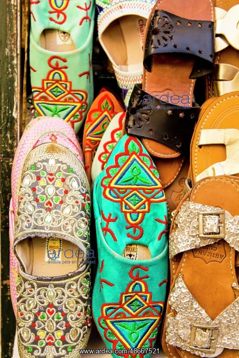 : Slippers shoes in shops along narrow cobblestone streets of : Slippers shoes in shops along narrow cobblestone streets of