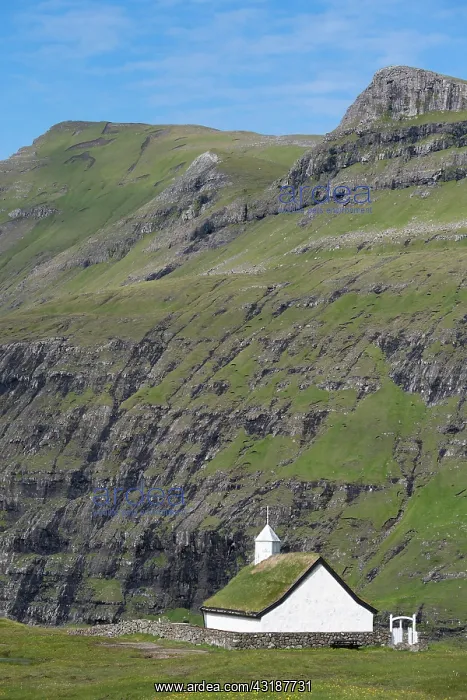 : Small church with grass roof in mountain landscape : Small church with grass roof in mountain landscape