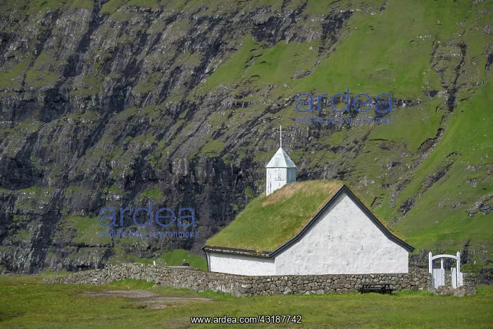 : Small church with grass roof in mountain landscape : Small church with grass roof in mountain landscape