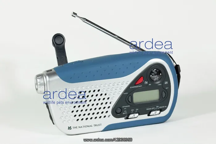 : Small windup clockwork dual band radio with torchlight : Small windup clockwork dual band radio with torchlight