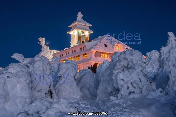  : Snow-covered Fichtelberghaus in the evening in winter