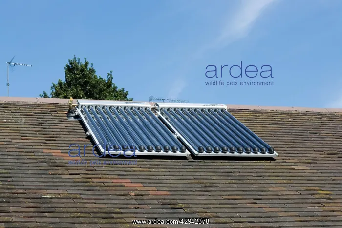 : Solar thermal panels with evacuated tubes on roof : Solar thermal panels with evacuated tubes on roof