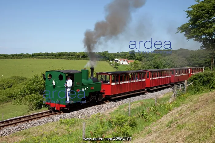 : Steam train with red carriages : Steam train with red carriages