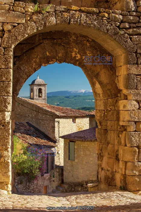 : Stone gate in Lacoste with Mount Ventoux : Stone gate in Lacoste with Mount Ventoux