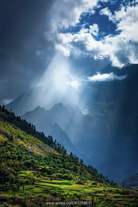 : Sun rays through clouds in Himalayan valley in Himalayas : Sun rays through clouds in Himalayan valley in Himalayas