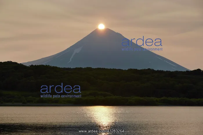 : Sunrise over the summit of the Ilyinsky volcano : Sunrise over the summit of the Ilyinsky volcano