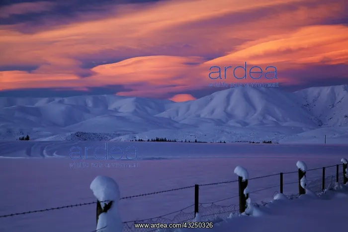 : Sunset over Hawkdun Range and snowy farmland : Sunset over Hawkdun Range and snowy farmland
