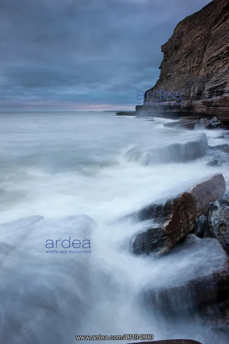 : Surf on the rocky coast with cliffs, Dunraven Bay : Surf on the rocky coast with cliffs, Dunraven Bay