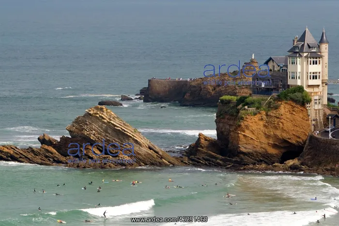 : Surfing Cote de Basque below a castle in : Surfing Cote de Basque below a castle in