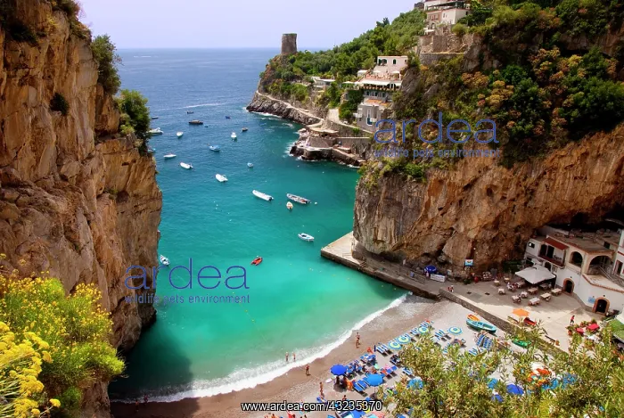 : Tiny beach in the rocky coastline of Amalfi : Tiny beach in the rocky coastline of Amalfi
