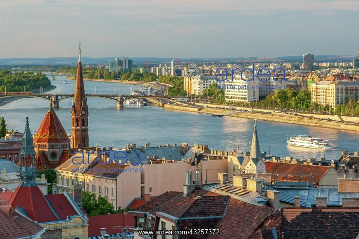 : Tour boat passes Hungary's Parliament, built between : Tour boat passes Hungary's Parliament, built between
