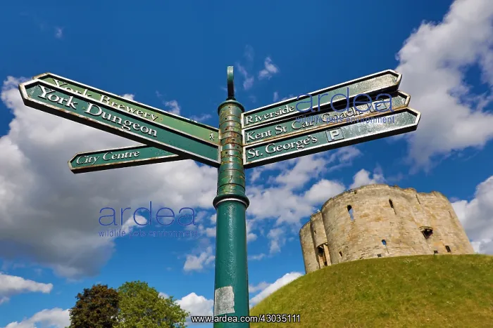 : Tourist information signpost and Clifford's Tower : Tourist information signpost and Clifford's Tower