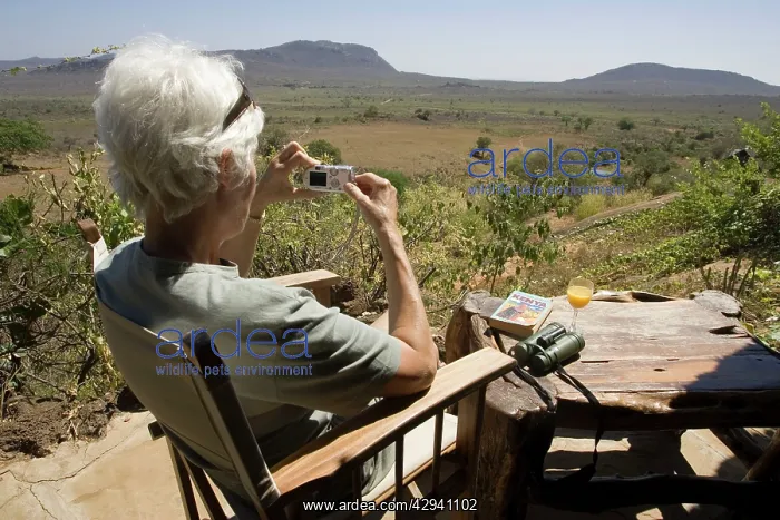 : Tourist - photographing scenery from veranda at : Tourist - photographing scenery from veranda at