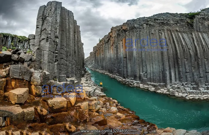 : Tourist at Studlagil Canyon, basalt columns, Egilsstadir : Tourist at Studlagil Canyon, basalt columns, Egilsstadir