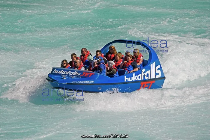 : Tourists in Huka Falls jet boat Waikato River : Tourists in Huka Falls jet boat Waikato River