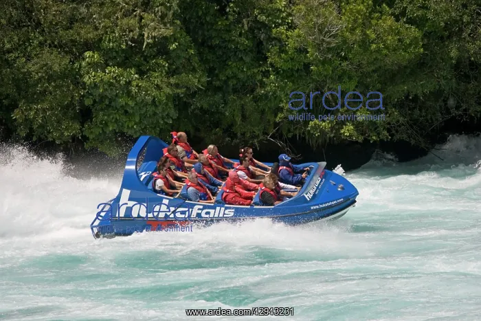 : Tourists in Huka Falls jet boat Waikato River : Tourists in Huka Falls jet boat Waikato River
